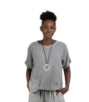 Raw-edge front pocket linen top