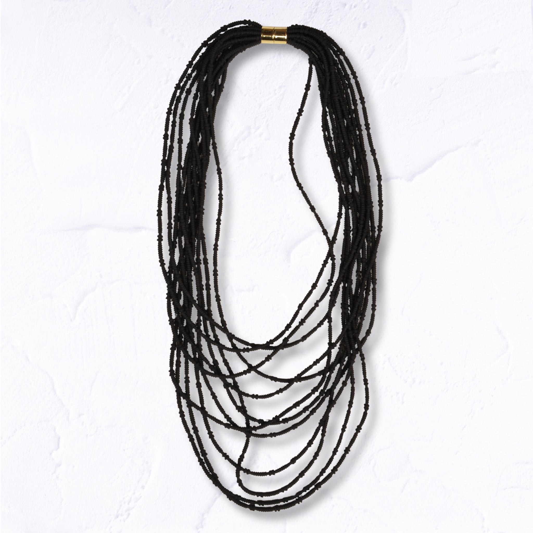 Multi string stretchy fabric necklace