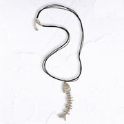 Fish pendant multi string necklace