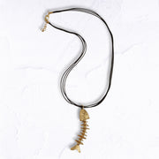 Fish pendant multi string necklace
