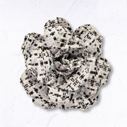 Check flower brooch