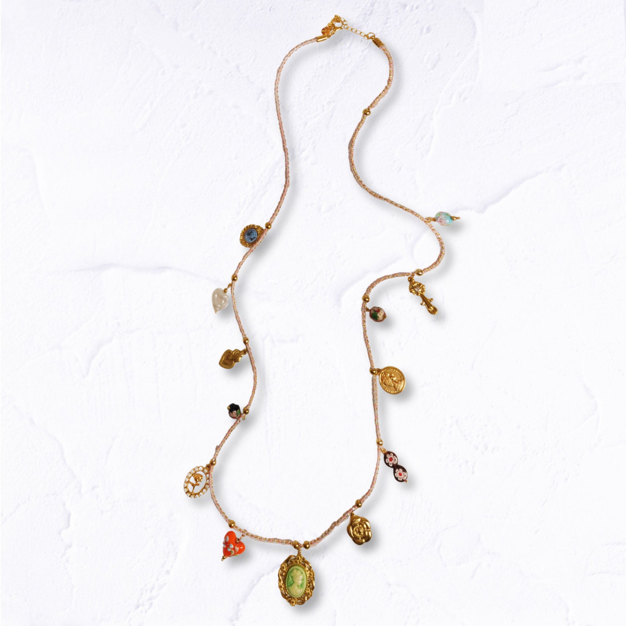 Multi charm woven string necklace