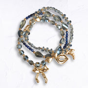 Bow lip charm multi string beaded bracelet