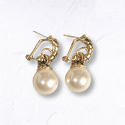 Giant pearl hoop earrings