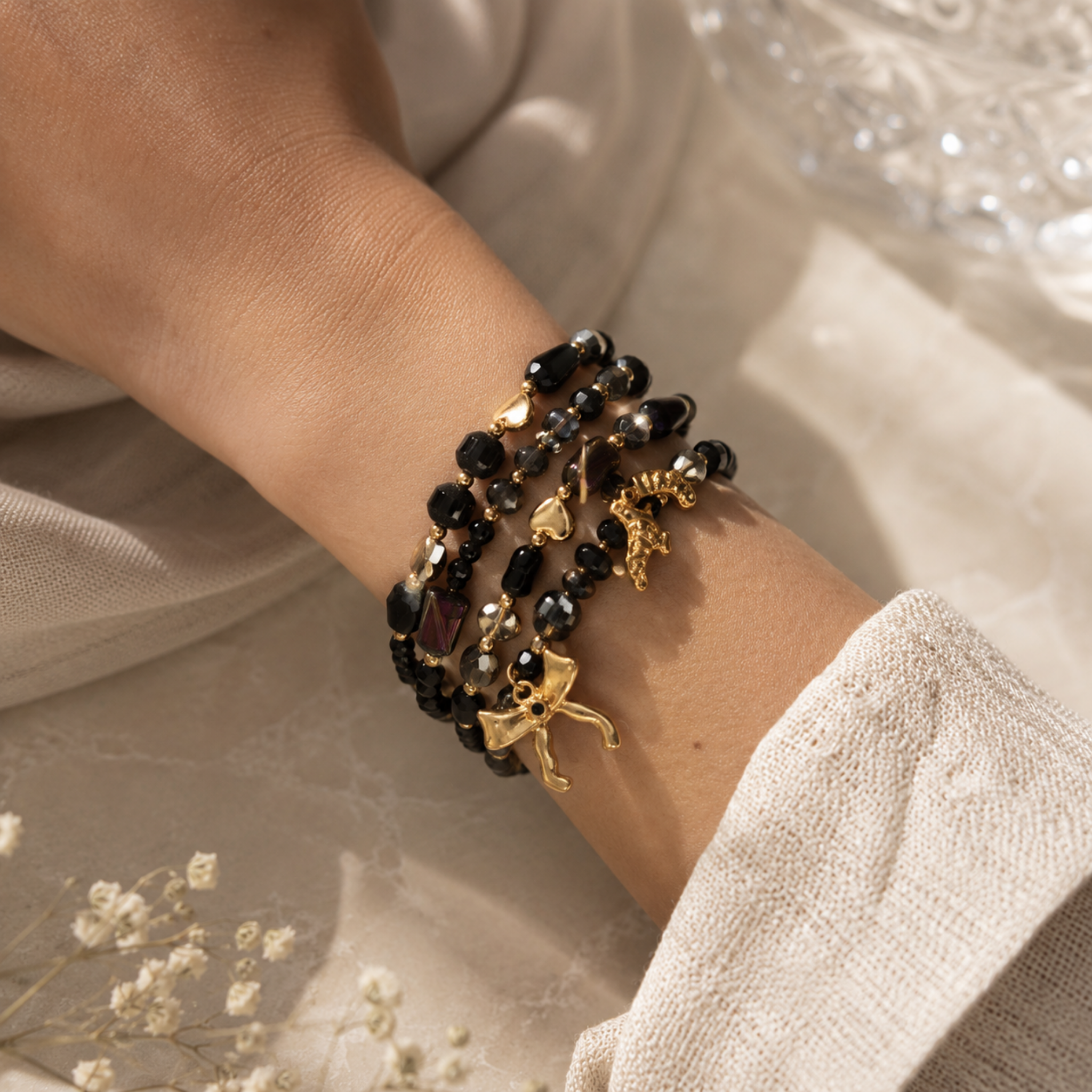 Bow charm multi string beaded bracelet