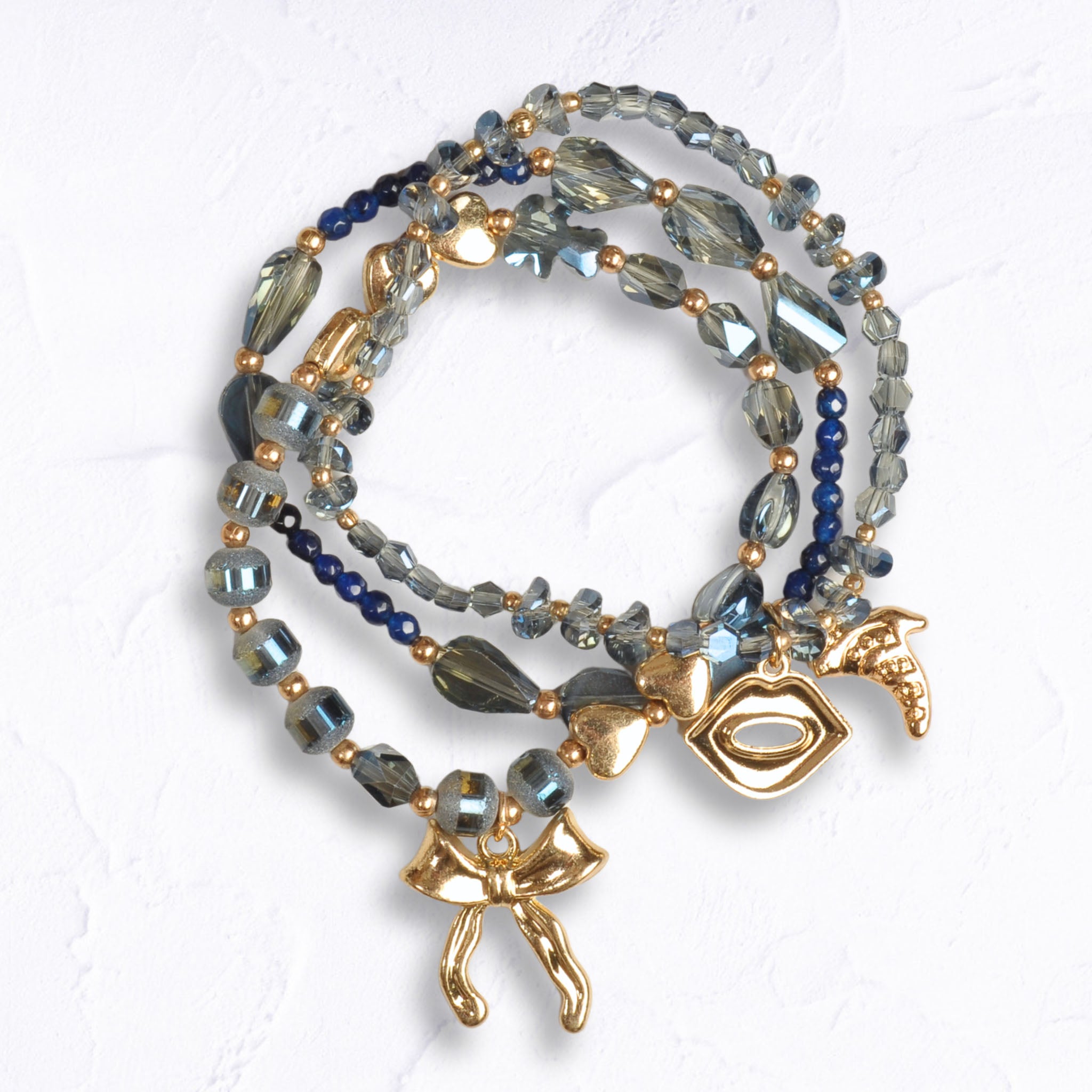 Bow lip charm multi string beaded bracelet