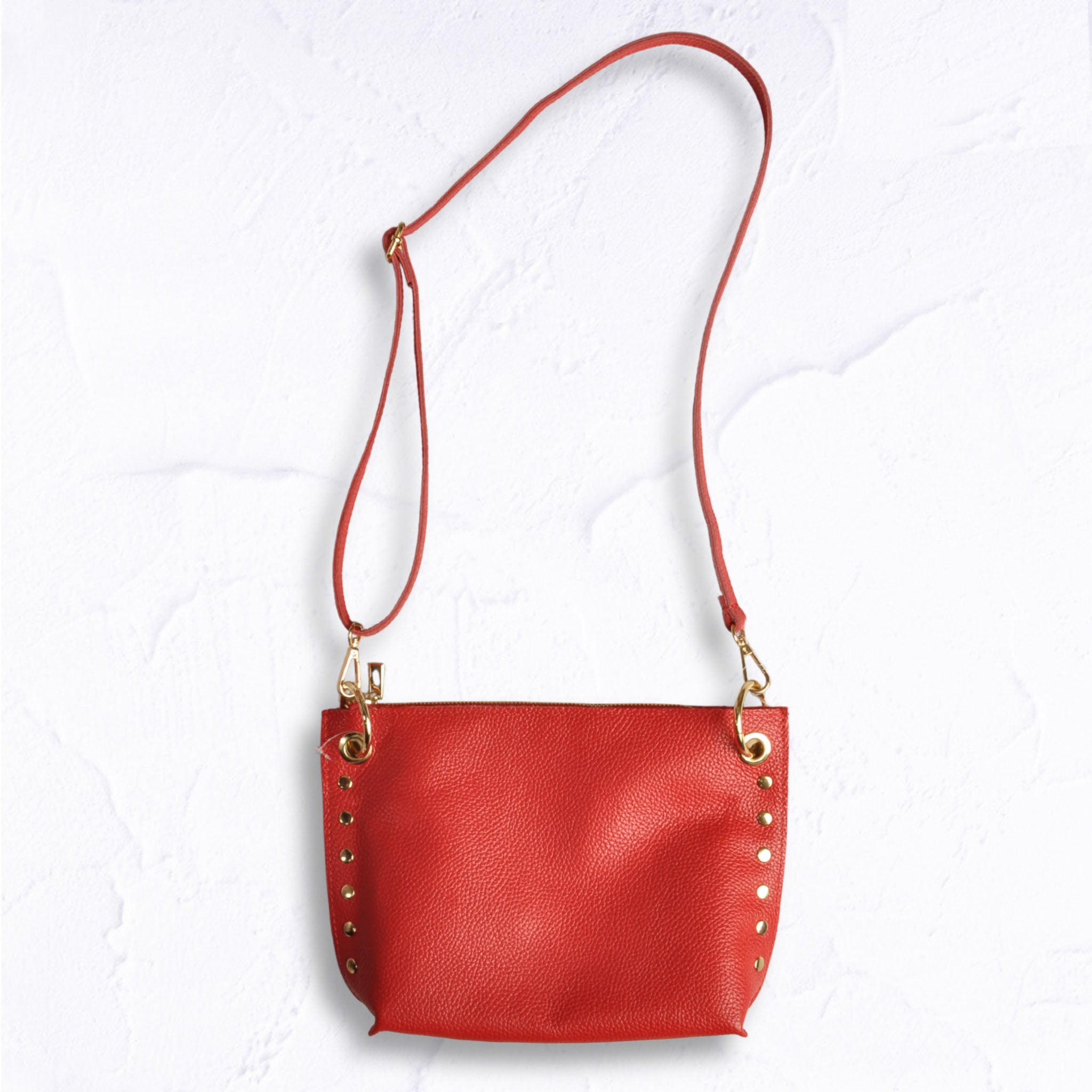 Gold stud eyelet genuine leather bag