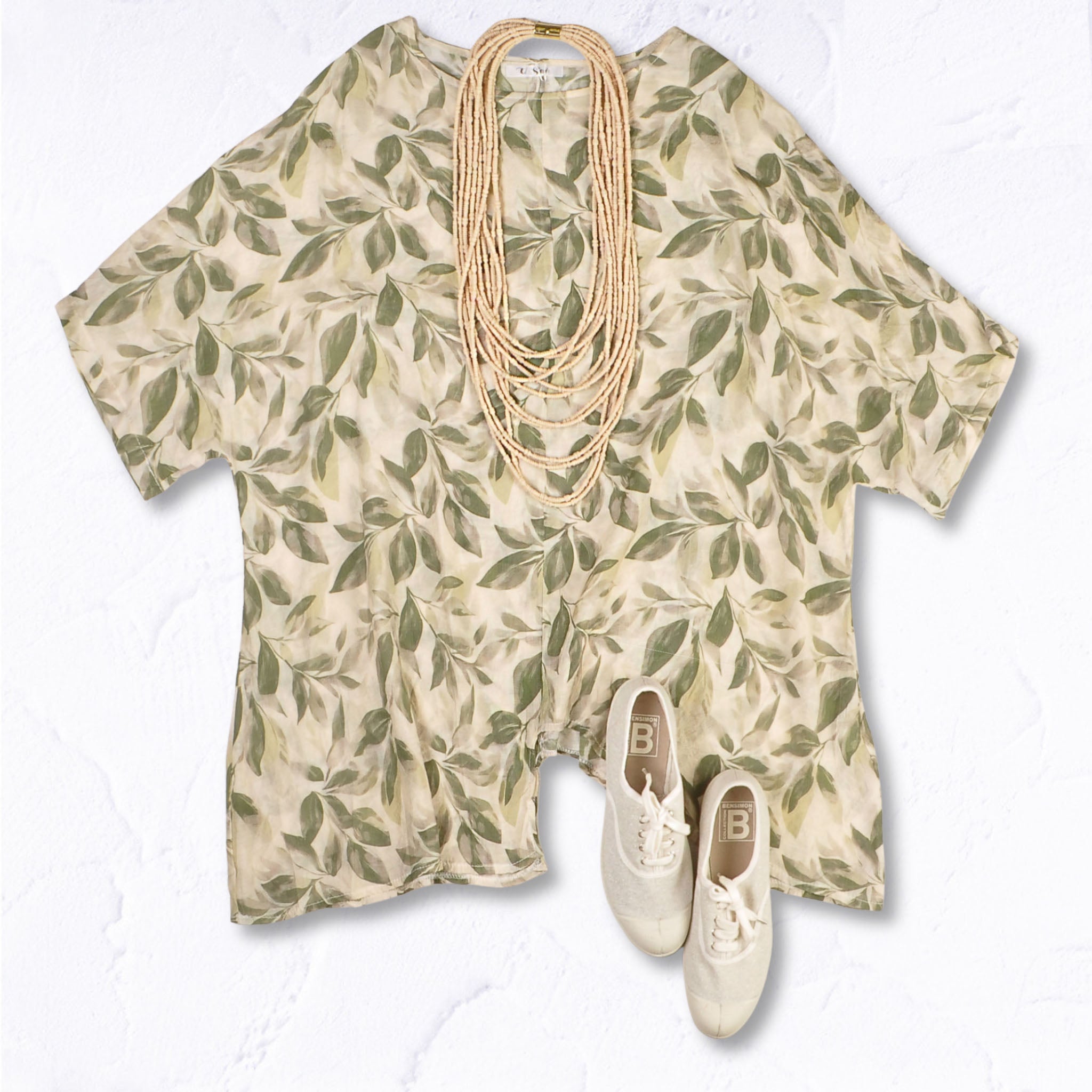 Oversized asymmetrical leaf print top